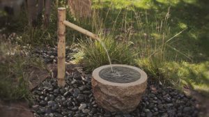 water features - natural looking streams and ponds - focal point landscapes with soothing movement and sound